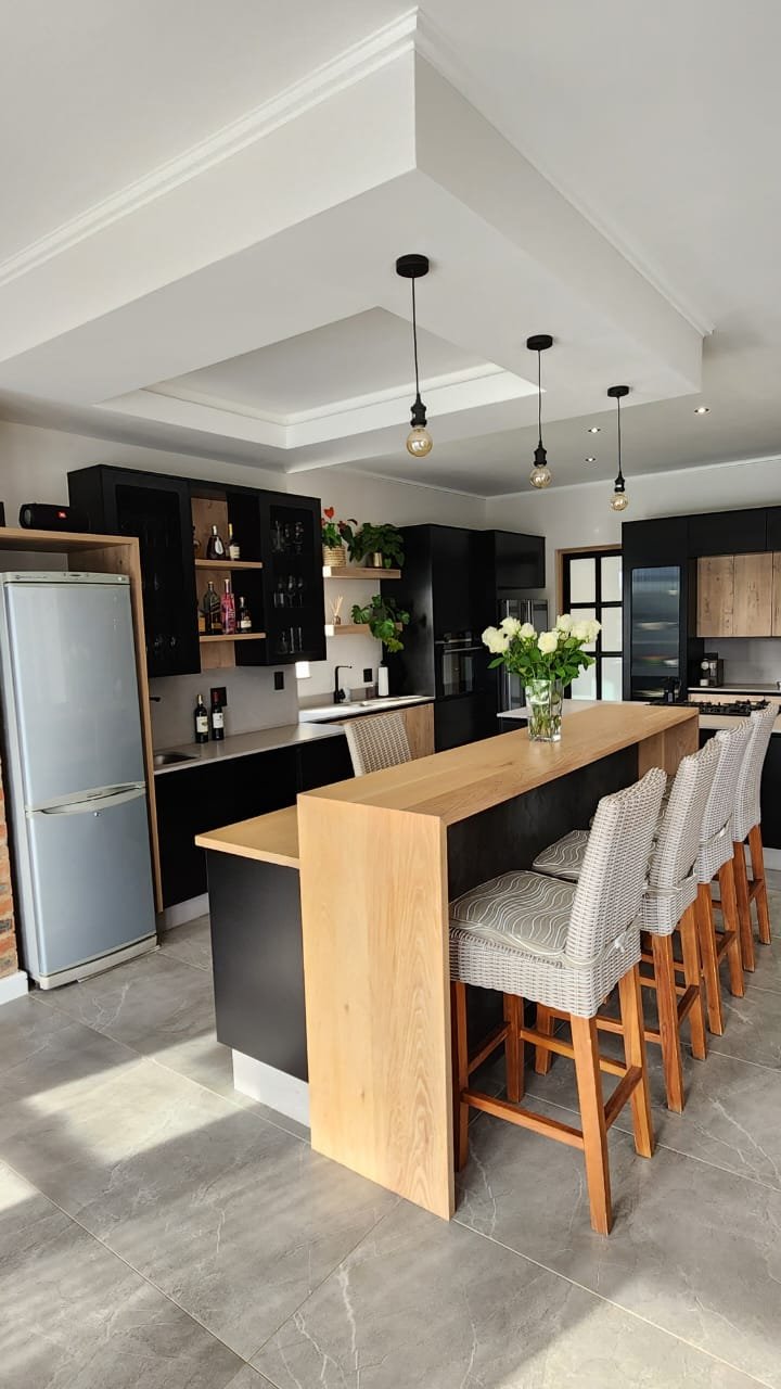 Custom oak breakfast bar with wicker stools